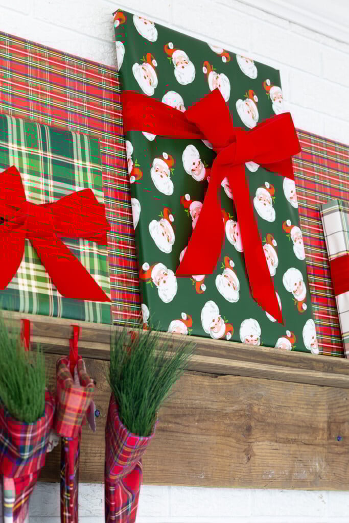 Easy Christmas mantel decorating idea using gift wrap and large frames.