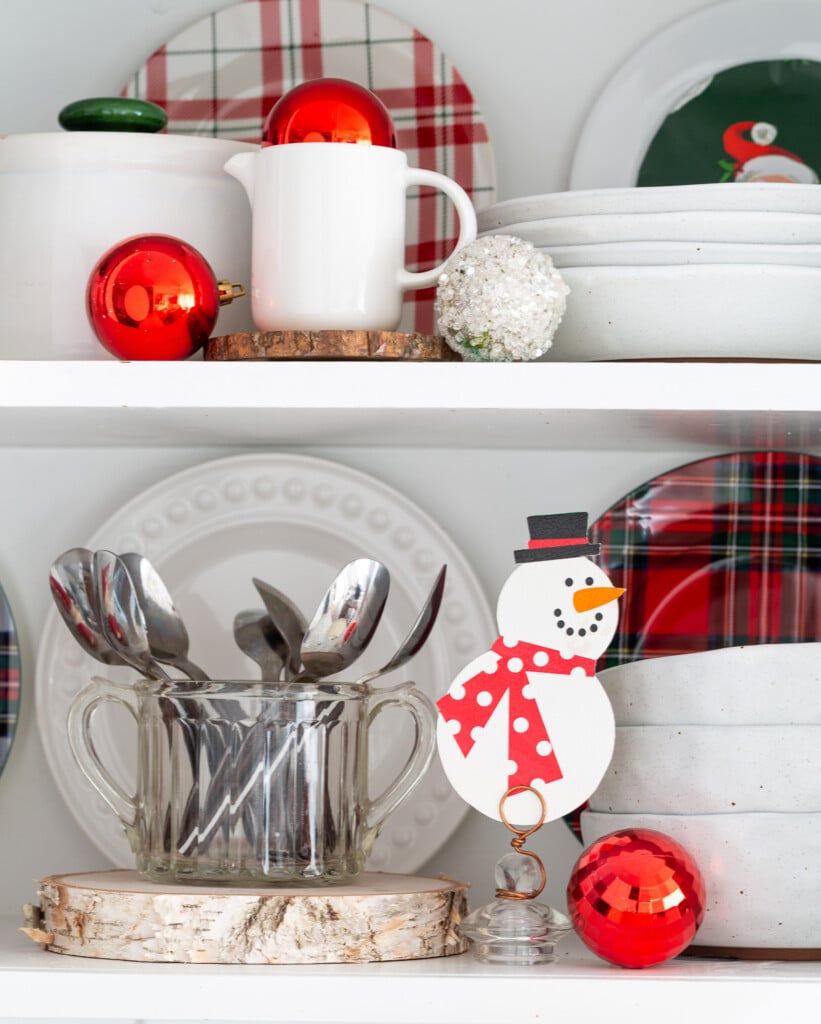 decorated shelves for Christmas using red, white and green color scheme.