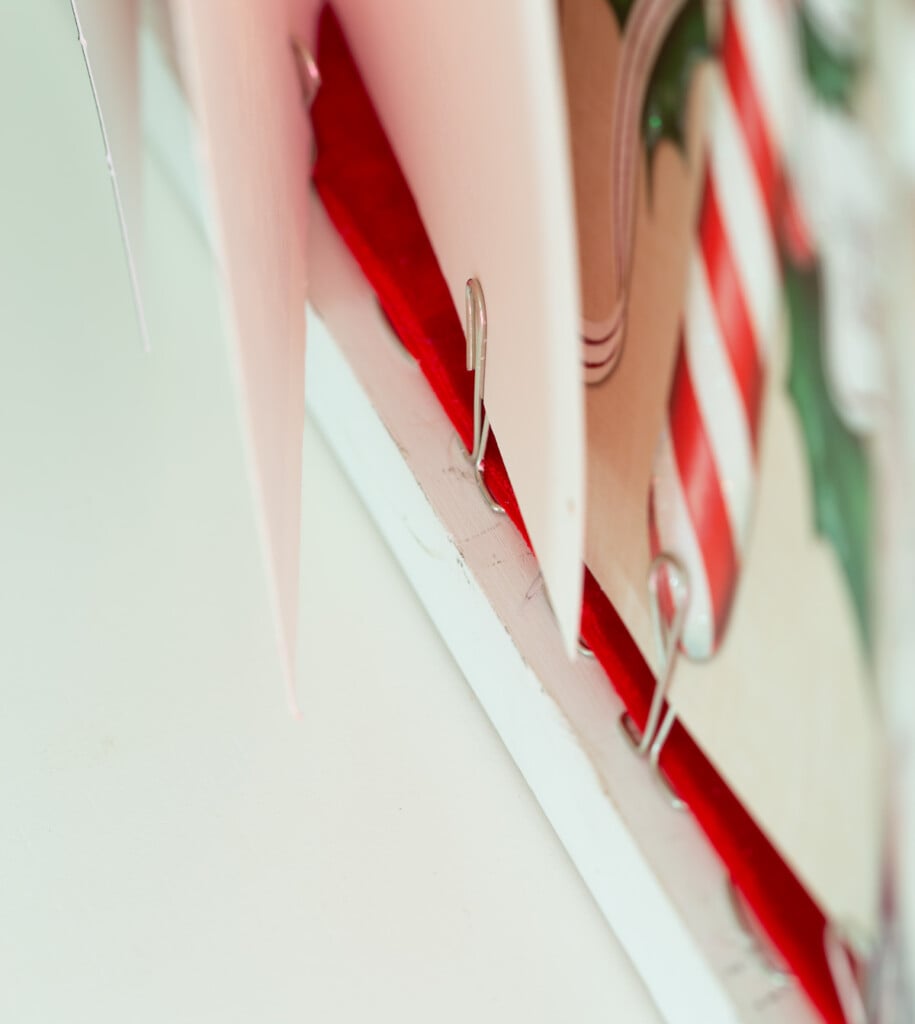 close up showing how to place Christmas cards in card holder.