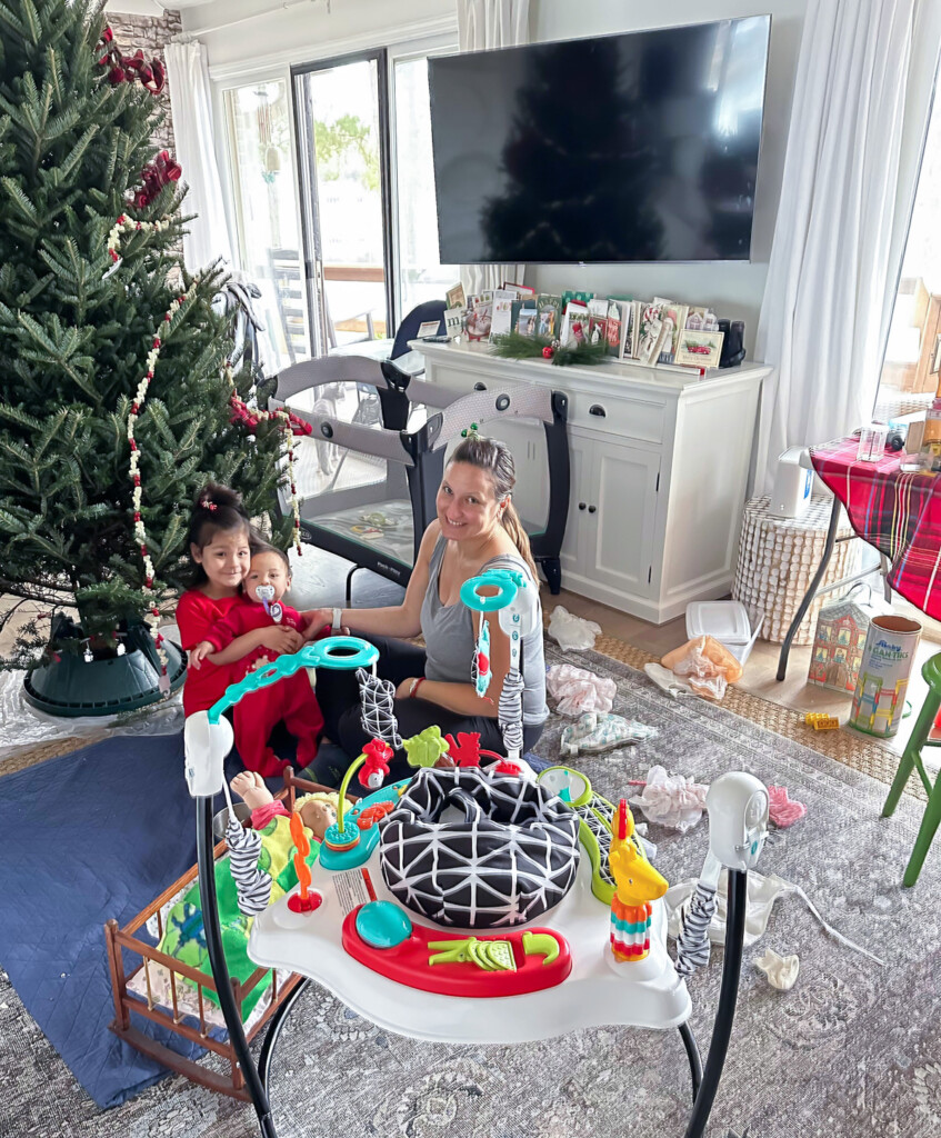 kids playing in messy living room getting decorated for the holidays