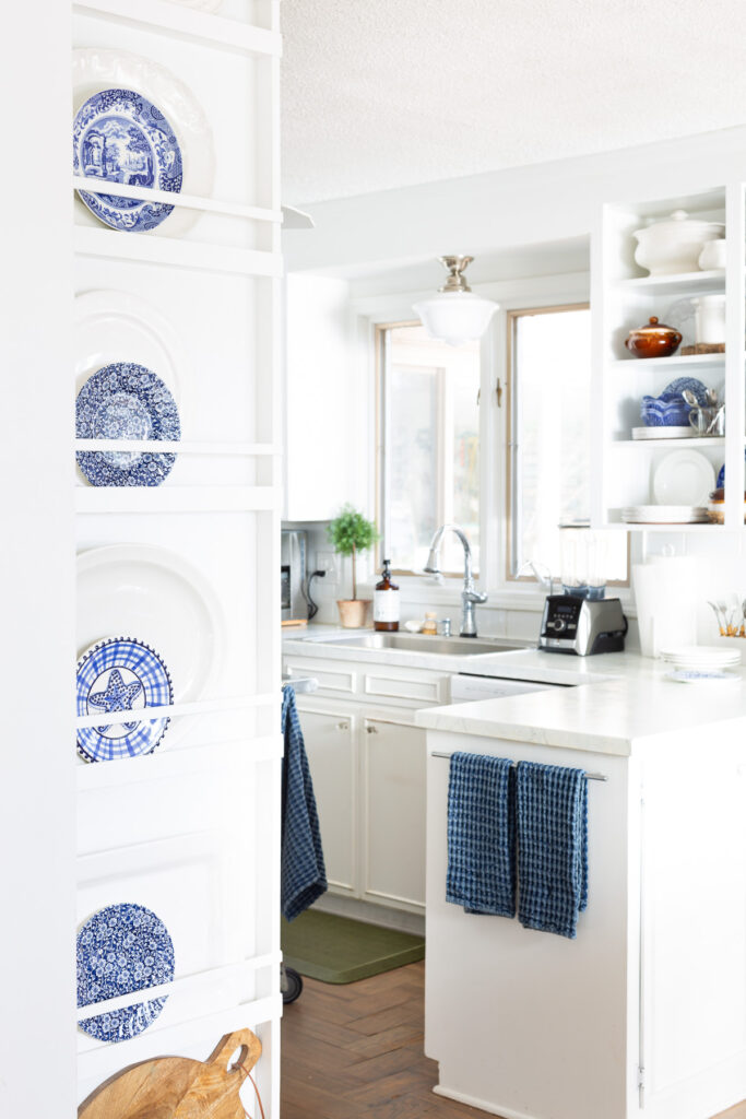 White kitchen with blue accents.