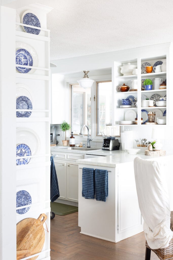 White kitchen with blue accents.