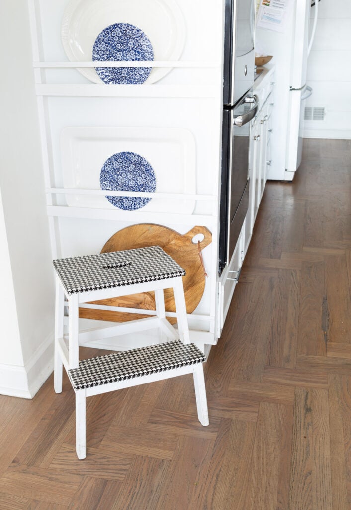 IKEA Bekvam Step Stool painted white with black and white houndstooth duck tape covering the steps.