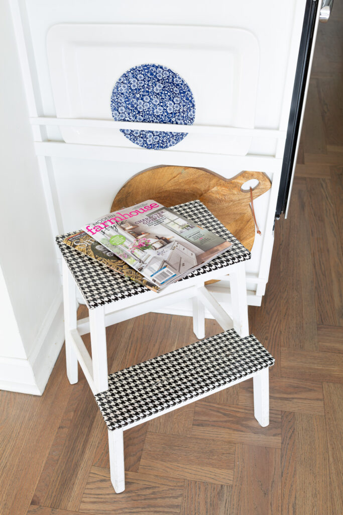 IKEA Bekvam Step Stool painted white with black and white houndstooth duck tape covering the steps.