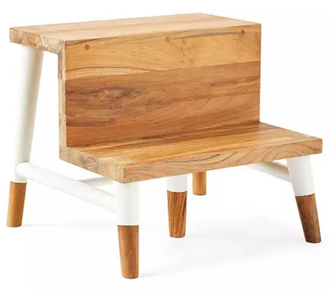Serena & Lily teak wood step stool with white accents.