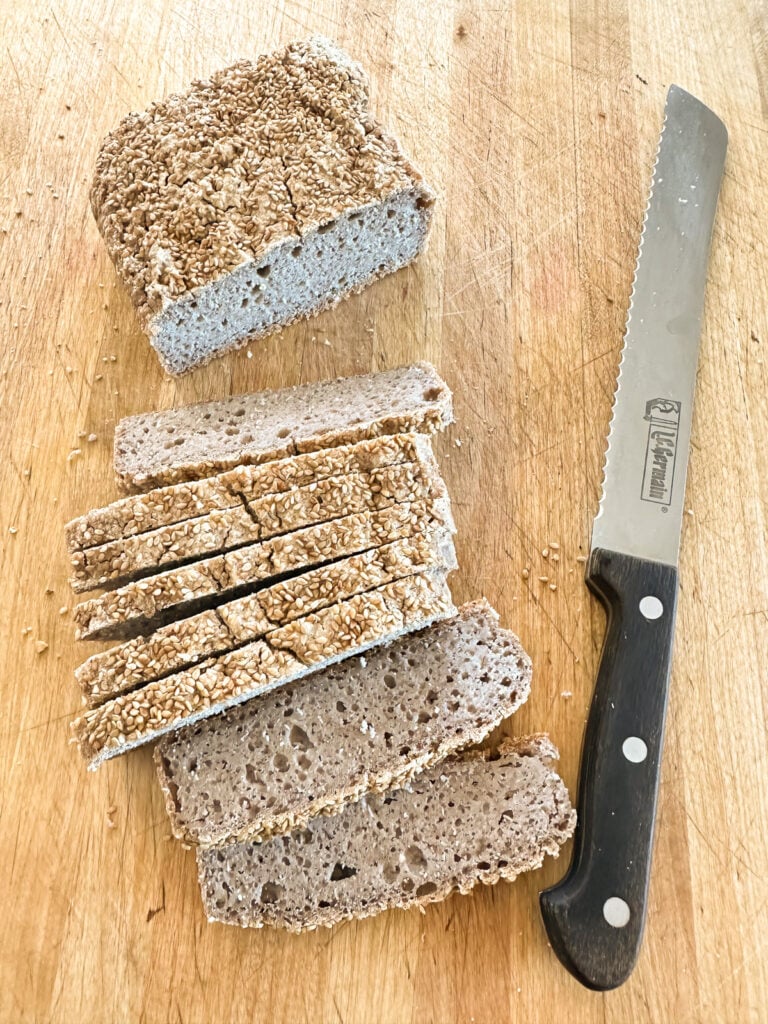 looking down at a loaf and slices of buckwheat bread.