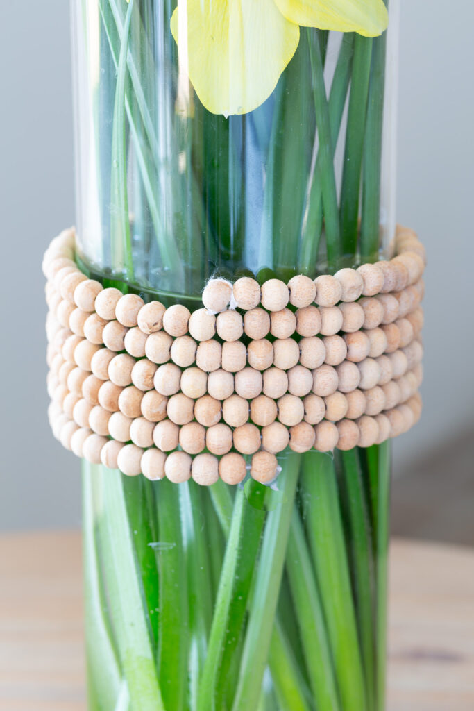 Why throw out perfectly nice bottles that condiments or liquor come in when they are empty. Why not head to your jewelry box or the thrift store to find a few pieces of old jewelry to decorate the vases from necklaces, bracelets and even clip on earrings. Don't miss all the creative old jewelry repurposing ideas.