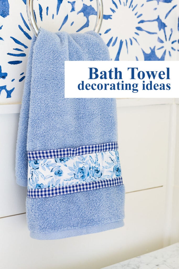 Blue and white hand towel. Copy says Bath towel decorating ideas.