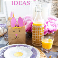 Easter table set using white, pink, purple and yellow.