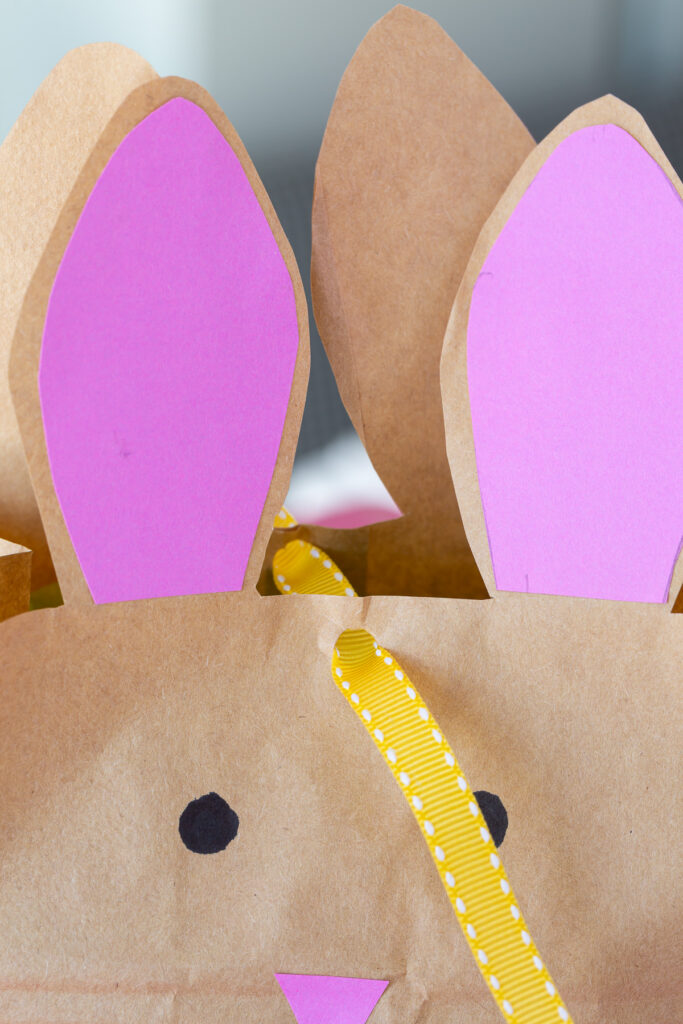 how to tie ribbon to close Easter bunny bag with ears.