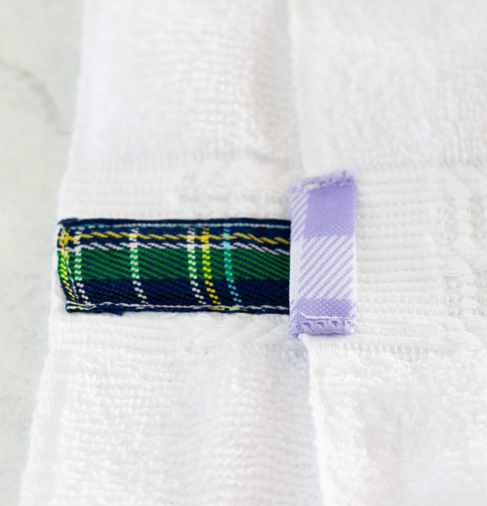 showing 2 ways to how to attach ribbon to a bathroom towel.