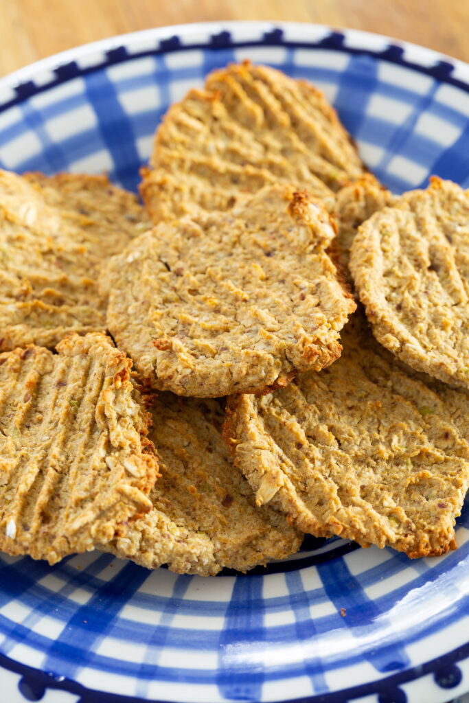 close up of the best healthy vegan cookies on a blue and white plate.