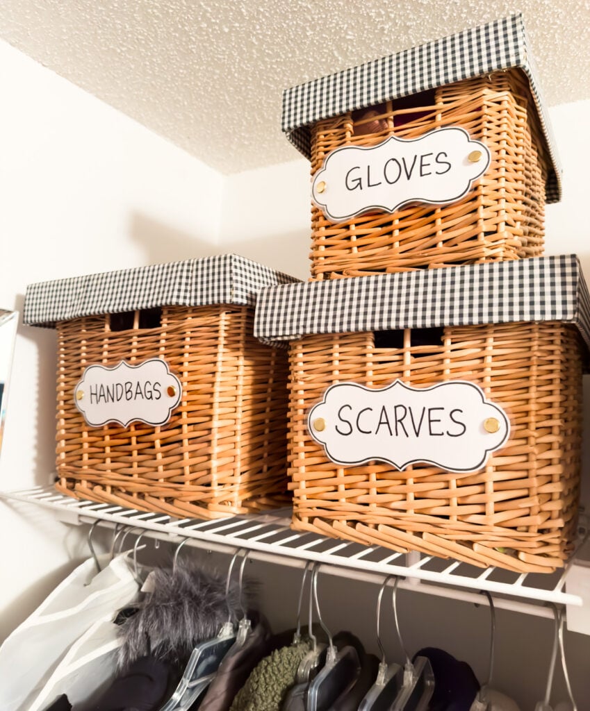 clothes closet organizing ideas using stackable baskets with DIY labels.