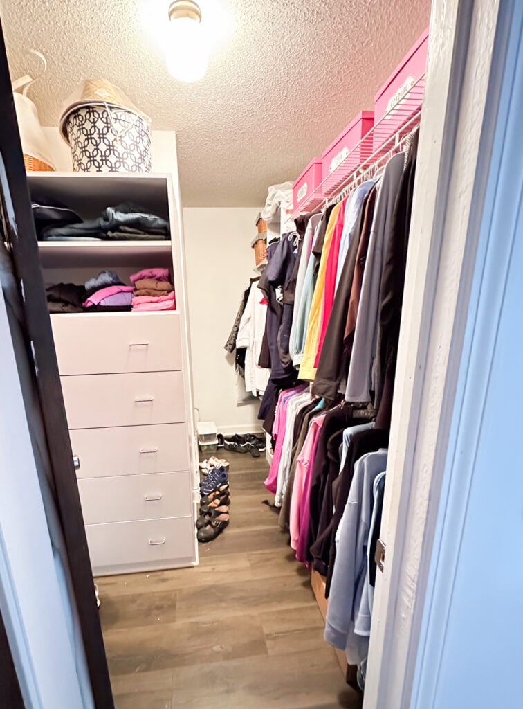 Clothes closet before getting cleaned out and reorganized.