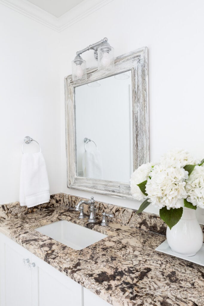 bathroom sink area in newly redecorated primary bathroom in a home.