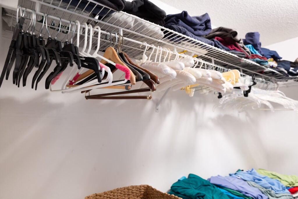 Excess clothes hangers after cleaning out no longer needed clothes from a closet.