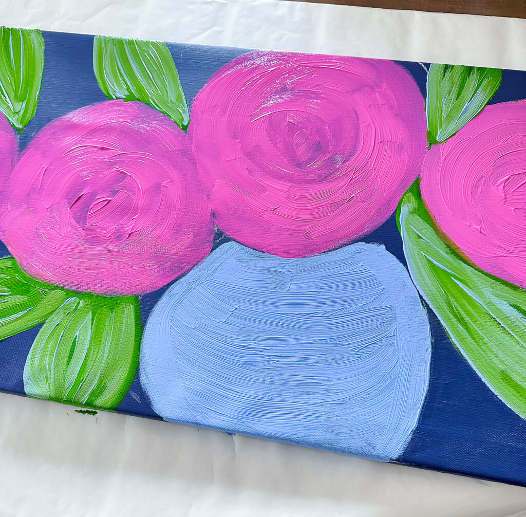 Step 2: Base color of a vase pink flowers and leaves on a art canvas showing the brush strokes.