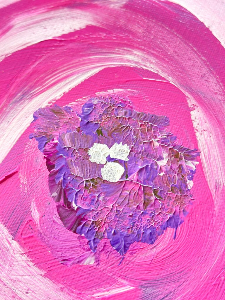close up of texture of acrylic paint mixed with gel medium on an art canvas.