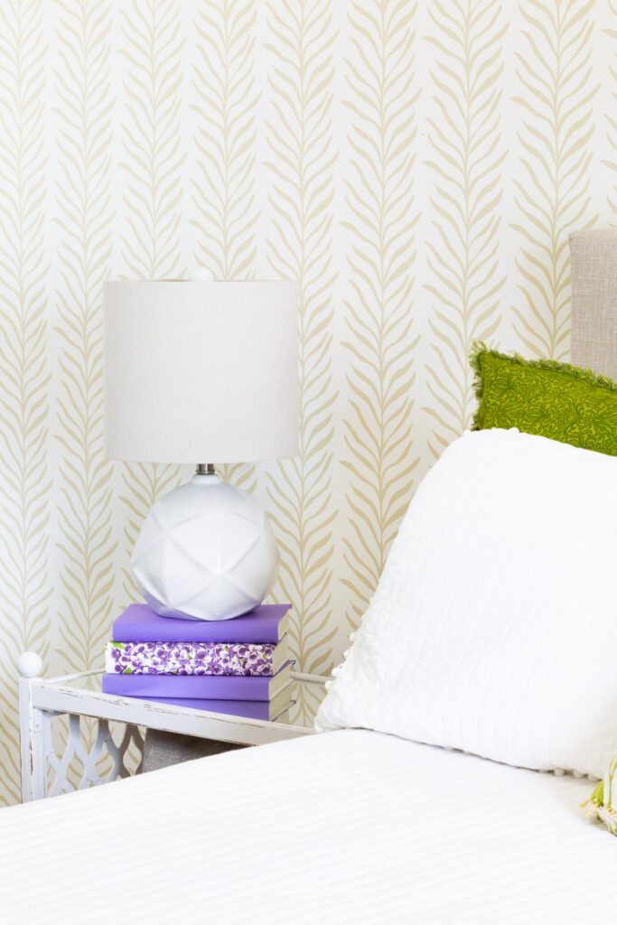 love vs design wallpaper pattern on a wall in a bedroom.