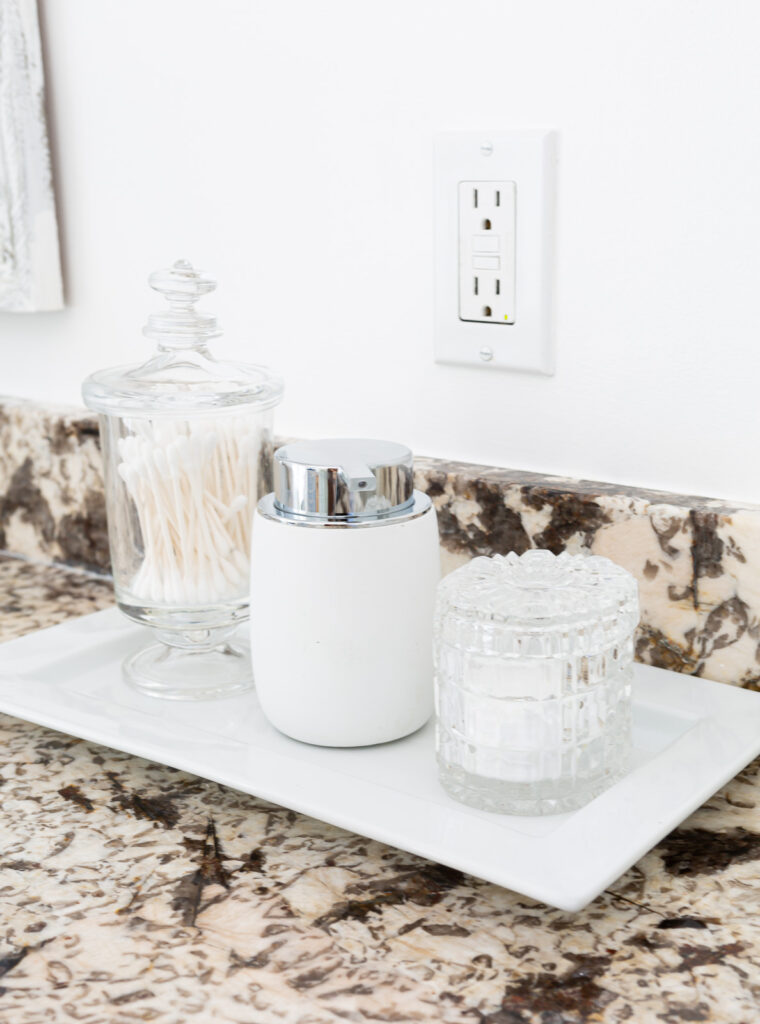 Pretty bathroom counter display where everyday bath items are in pretty container instead of the packaging containers they come in.