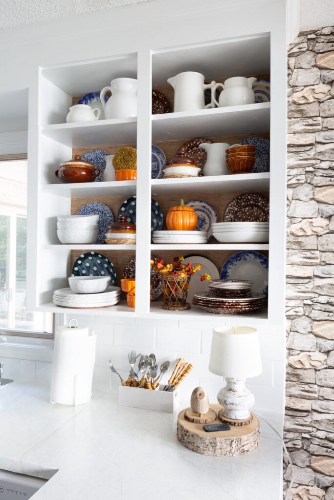 View of completed color and style changes of open kitchen shelves for fall.
