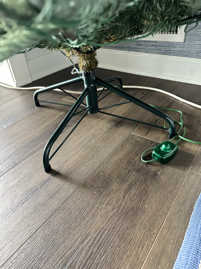 King of Christmas tree stand and on/off foot button for lights.
