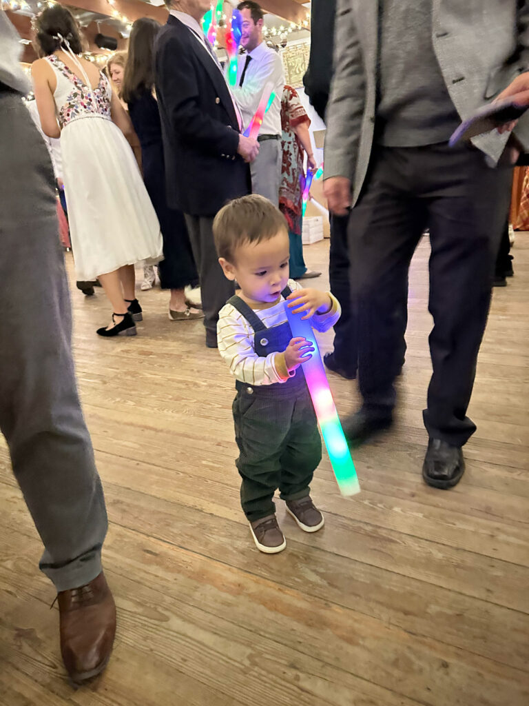 Grandson playing with foam light up glow sticks