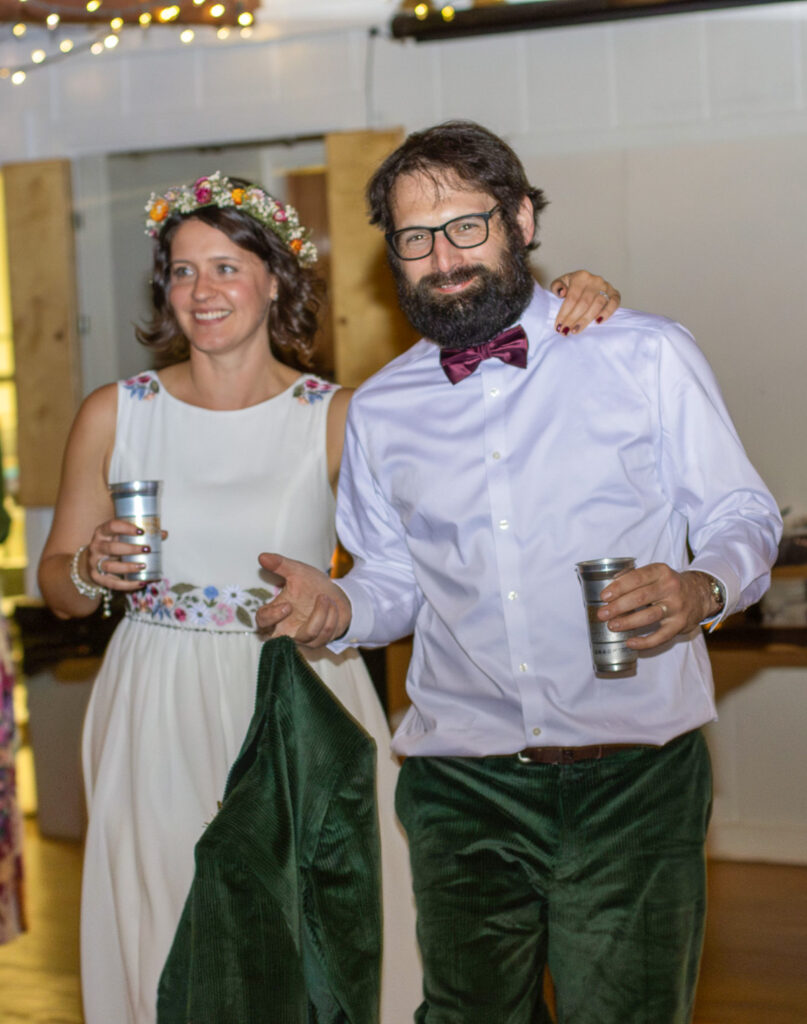 bride and groom taking a drink break