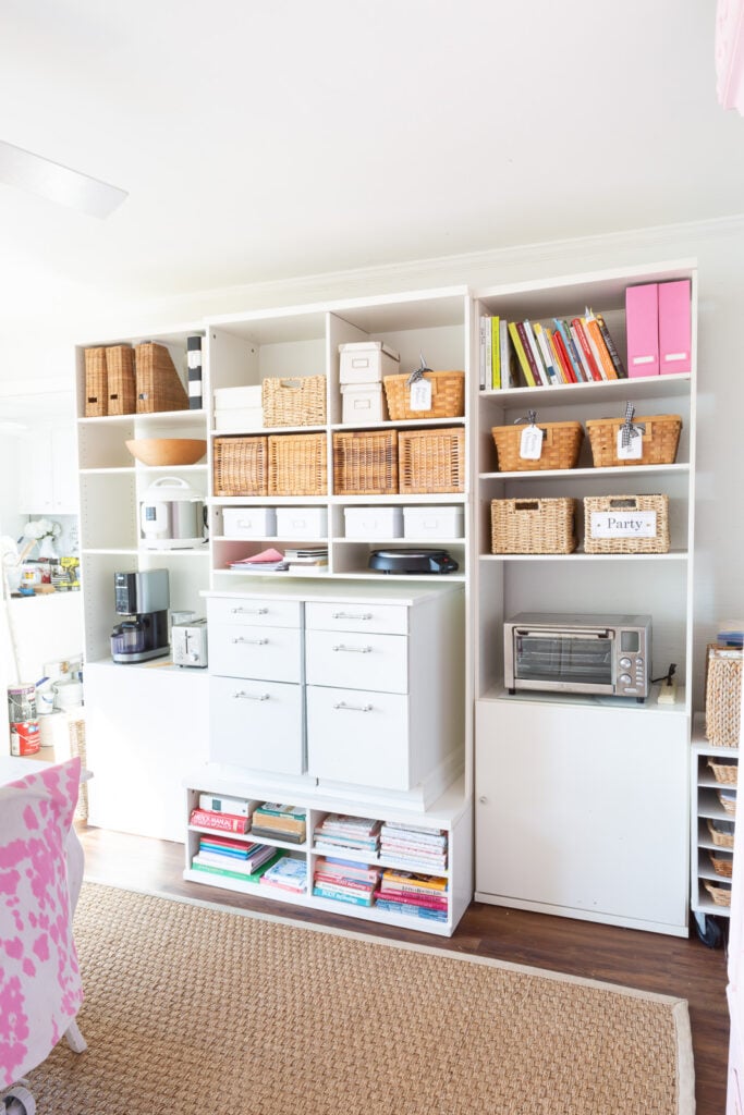 Vintage IKEA TV and media wall unit remade to use to hold a variety of kitchen, pantry and other items in a multi-purpose room.