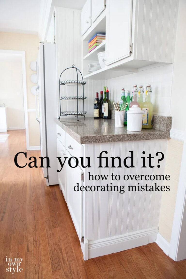 white kitchen with beadboard on side of the cabinets that was placed on wrong.