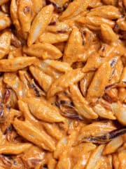 Close up of scissor cut tofu pasta noodles with creamy gochujang sauce.