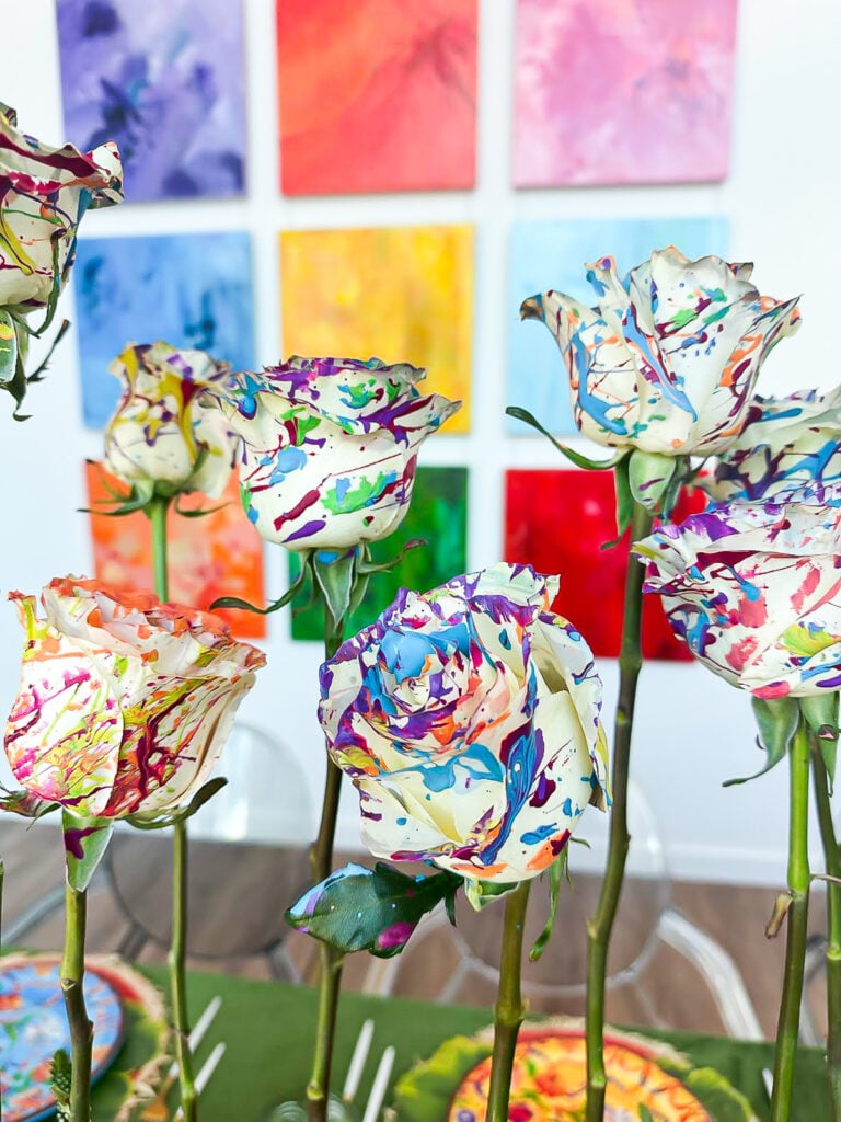 Splatter painted roses in an table centerpiece.