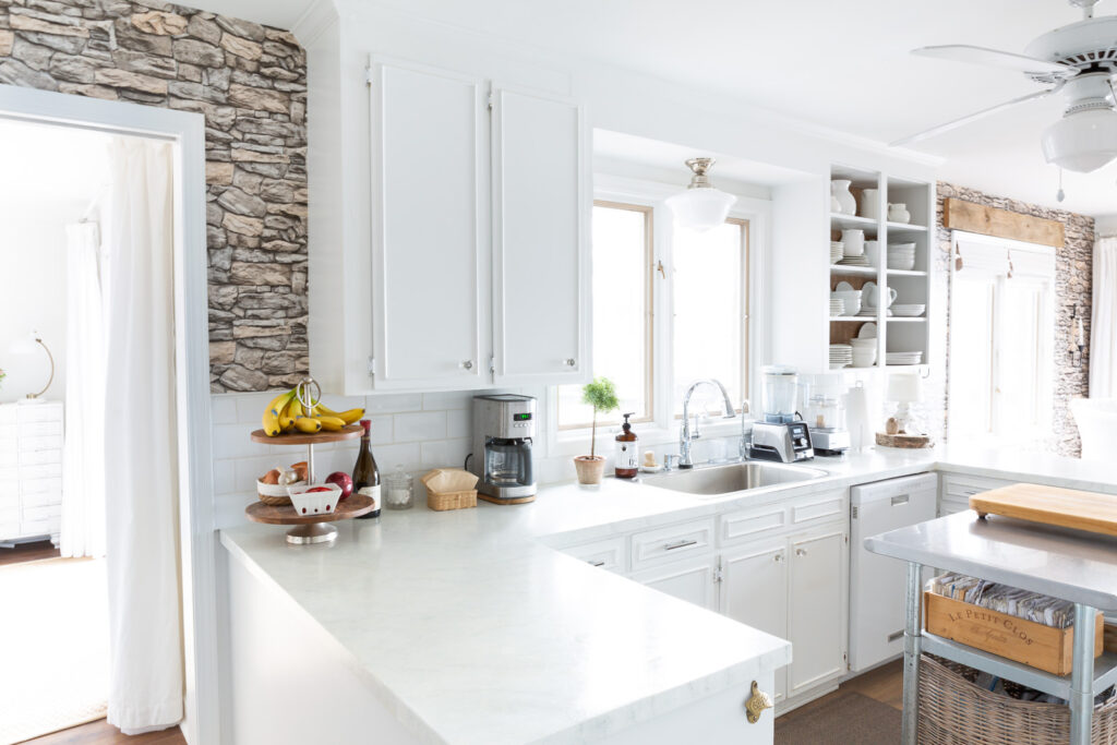 Wide view of long wall in kitchen and dining area.