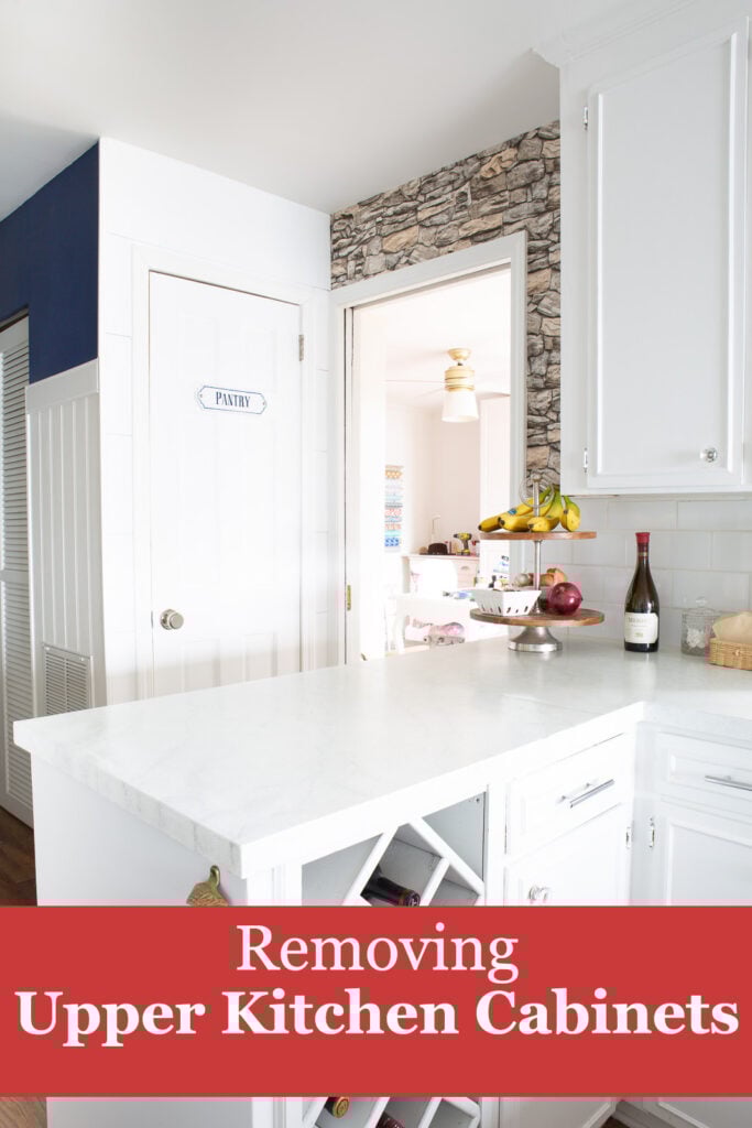 a section of upper kitchen cabinets have been removed in this space.