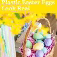 Speckled painted Easter eggs in an Easter basket on a table.