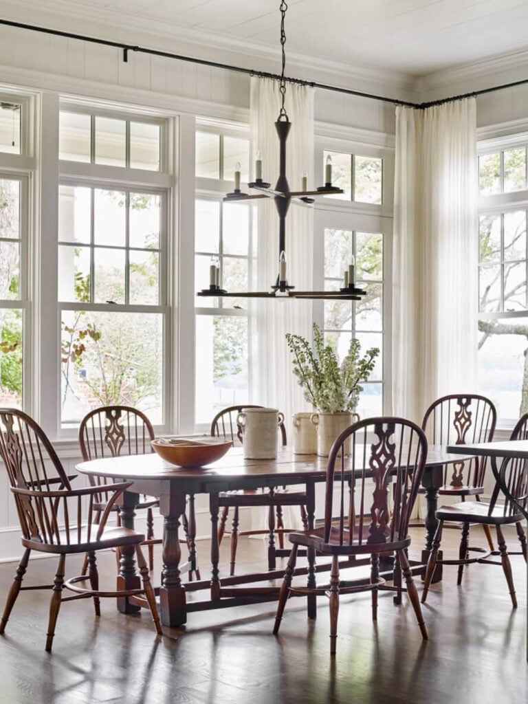 open dining area with windsor chairs around table
