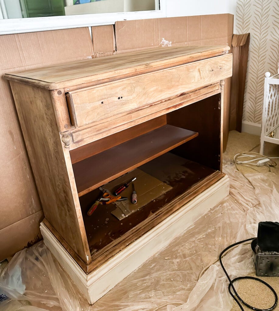 looking at the front of a just paint stripped piece of furniture