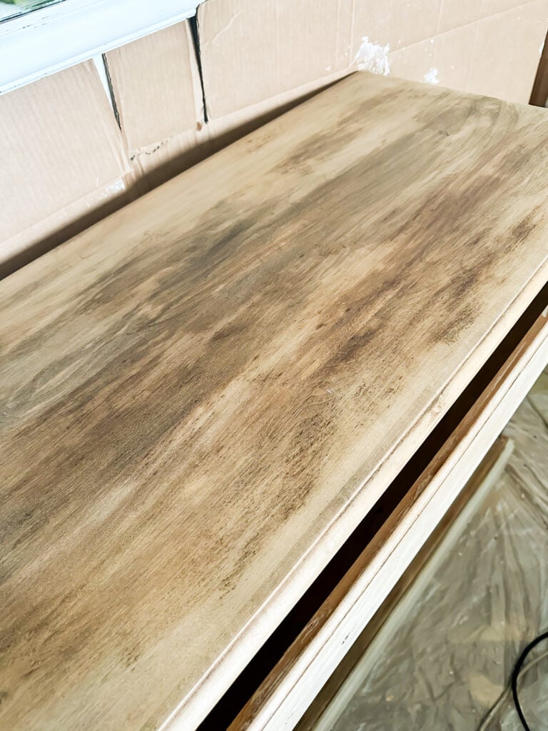 top of stripped piece of wood furniture