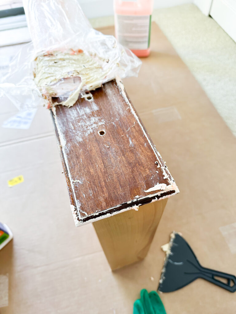 Wood front of drawer stripped of paint using Citrastrip and a plastic film.
