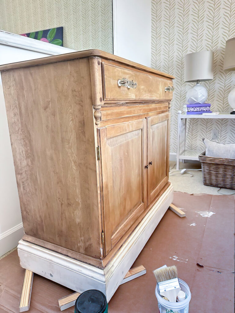 Looking at the side of a just paint stripped wood cabinet.