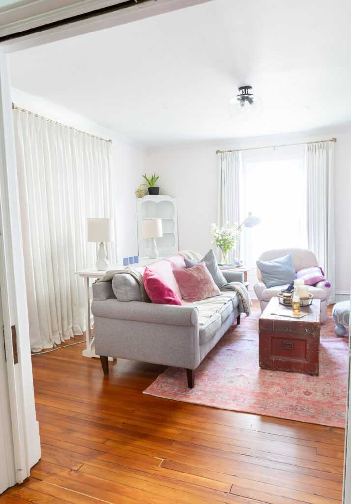 view looking into room where you can see both windows in the room. 