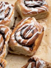 Olive oil cinnamon rolls on brown baking paper.