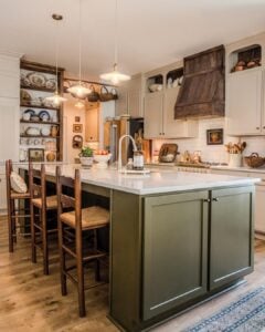 beautiful cozy country kitchen with an olive colored island