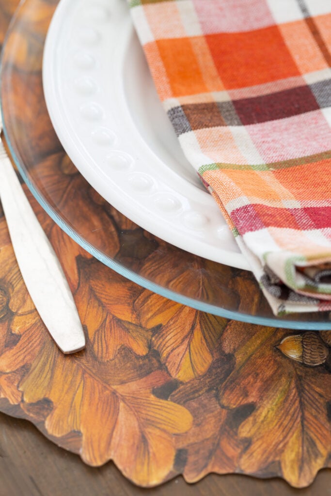 close up of the cut edge of the Autumn Wreath paper placemat made by Hester & Cook.