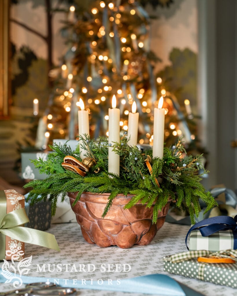 copper mold used as a Christmas candle centerpiece