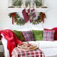 Where cozy meets Christmas. A red and green decorated living room.