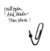 Make Paper clips pretty with small beads