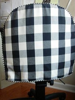 Black and white checked fabric cover.
