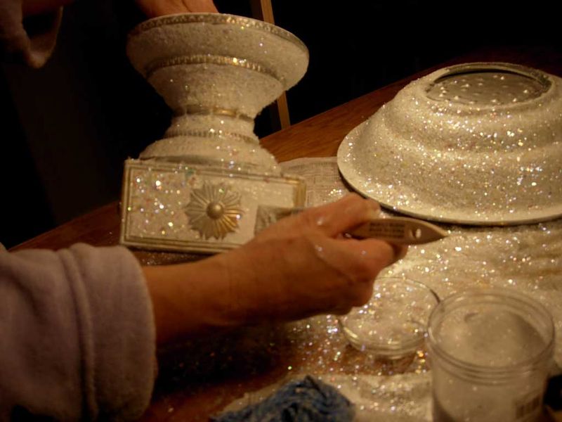adding glitter to the base and bowl of the ornament bowl centerpiece