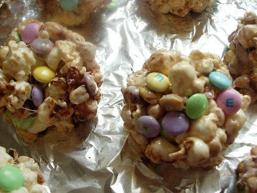 Popcorn mix formed into balls on sheet of foil.